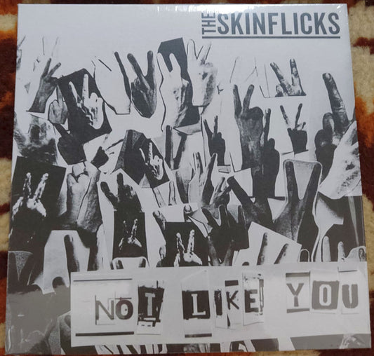The Skinflicks : Not Like You (7", Single, Whi)